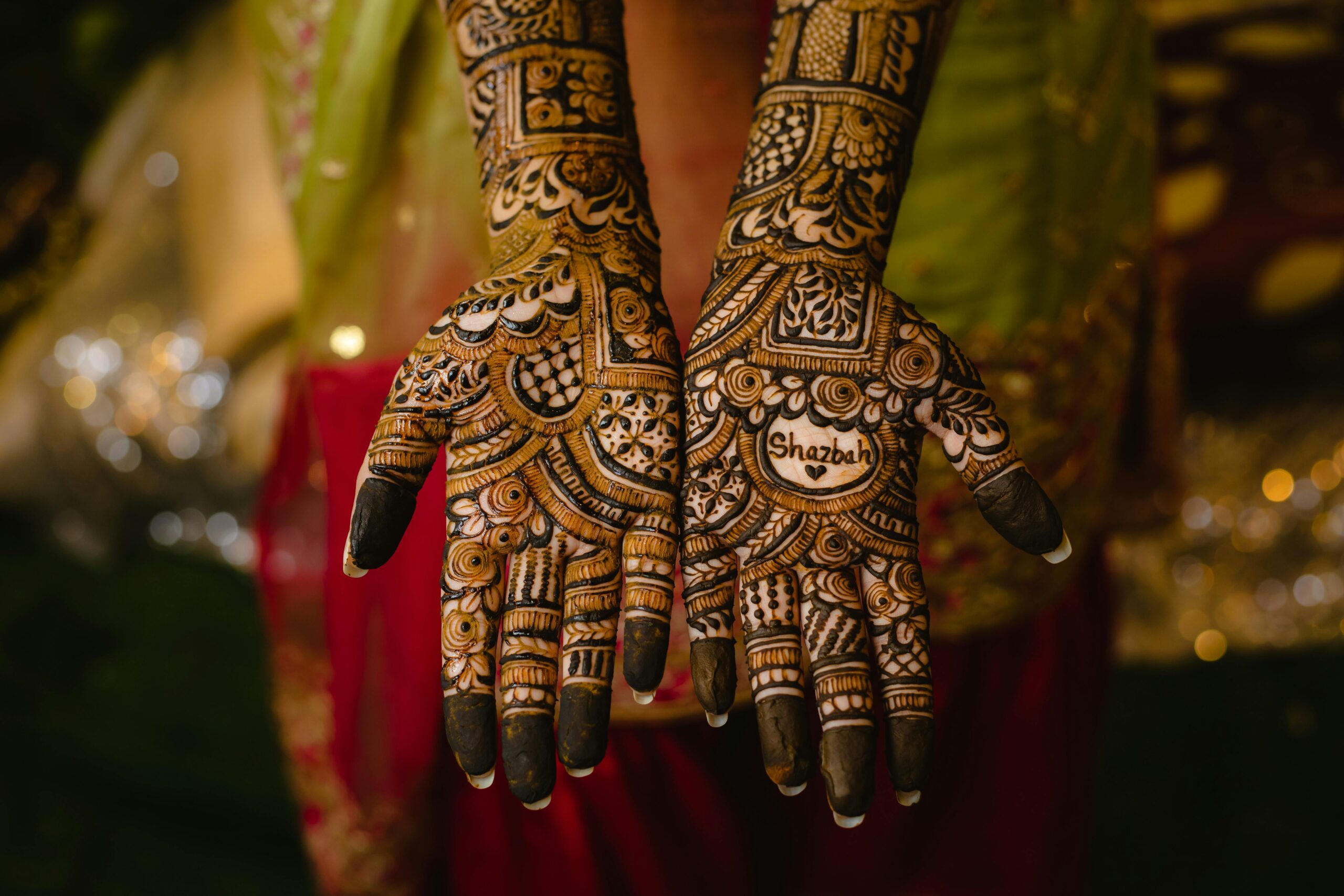 Beautiful close-up of traditional bridal henna designs on hands in Dhaka, Bangladesh.